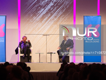 Thomas Johannes Gottschalk, a German television host, and Jorg Thadeusz, a German journalist, are seen on the stage at Flora Hall in Cologne...