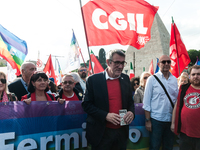 People attend a rally as part of the National Mobilization Day themed 'Let's stop the wars, the time for peace is now' in Rome, Italy, on Oc...