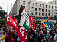 People attend a rally as part of the National Mobilization Day themed 'Let's stop the wars, the time for peace is now' in Rome, Italy, on Oc...