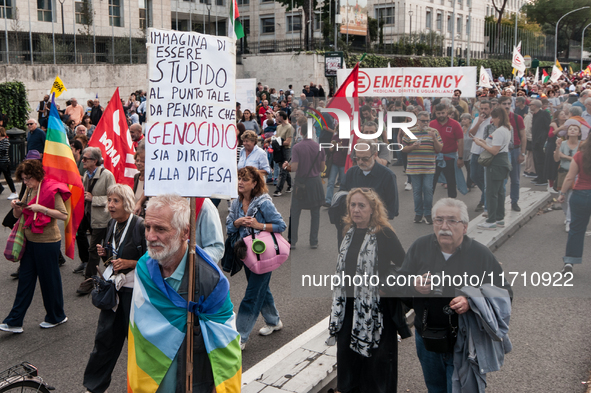 People attend a rally as part of the National Mobilization Day themed 'Let's stop the wars, the time for peace is now' in Rome, Italy, on Oc...