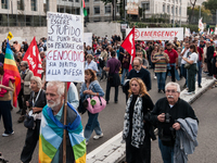 People attend a rally as part of the National Mobilization Day themed 'Let's stop the wars, the time for peace is now' in Rome, Italy, on Oc...