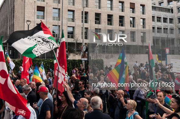 People attend a rally as part of the National Mobilization Day themed 'Let's stop the wars, the time for peace is now' in Rome, Italy, on Oc...