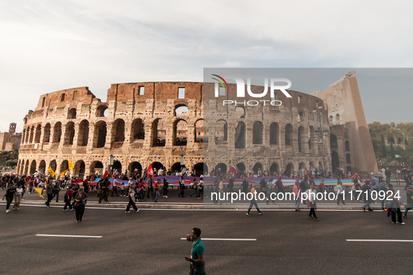 People attend a rally as part of the National Mobilization Day themed 'Let's stop the wars, the time for peace is now' in Rome, Italy, on Oc...