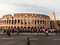 People attend a rally as part of the National Mobilization Day themed 'Let's stop the wars, the time for peace is now' in Rome, Italy, on Oc...