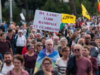 People attend a rally as part of the National Mobilization Day themed 'Let's stop the wars, the time for peace is now' in Rome, Italy, on Oc...