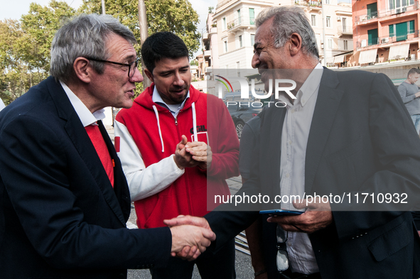 People attend a rally as part of the National Mobilization Day themed 'Let's stop the wars, the time for peace is now' in Rome, Italy, on Oc...