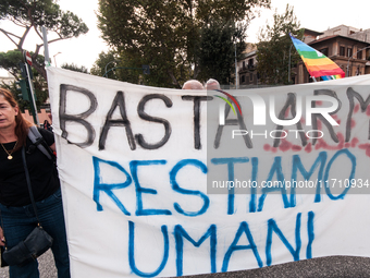 People attend a rally as part of the National Mobilization Day themed 'Let's stop the wars, the time for peace is now' in Rome, Italy, on Oc...