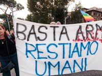 People attend a rally as part of the National Mobilization Day themed 'Let's stop the wars, the time for peace is now' in Rome, Italy, on Oc...