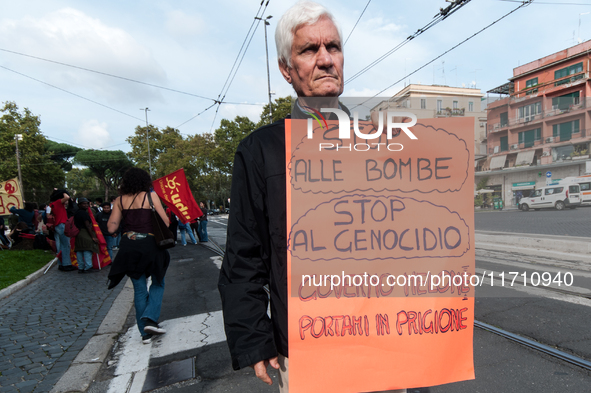 People attend a rally as part of the National Mobilization Day themed 'Let's stop the wars, the time for peace is now' in Rome, Italy, on Oc...