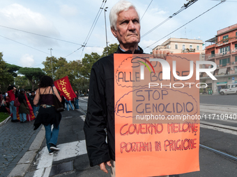 People attend a rally as part of the National Mobilization Day themed 'Let's stop the wars, the time for peace is now' in Rome, Italy, on Oc...