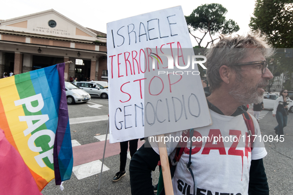 People attend a rally as part of the National Mobilization Day themed 'Let's stop the wars, the time for peace is now' in Rome, Italy, on Oc...