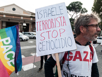 People attend a rally as part of the National Mobilization Day themed 'Let's stop the wars, the time for peace is now' in Rome, Italy, on Oc...