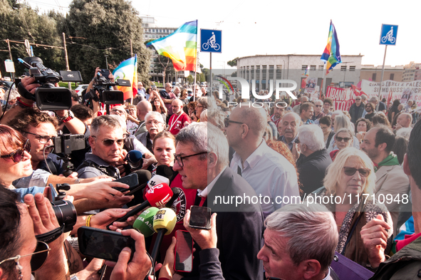 People attend a rally as part of the National Mobilization Day themed 'Let's stop the wars, the time for peace is now' in Rome, Italy, on Oc...