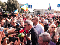 People attend a rally as part of the National Mobilization Day themed 'Let's stop the wars, the time for peace is now' in Rome, Italy, on Oc...