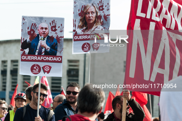 People attend a rally as part of the National Mobilization Day themed 'Let's stop the wars, the time for peace is now' in Rome, Italy, on Oc...