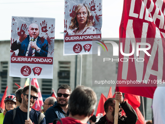 People attend a rally as part of the National Mobilization Day themed 'Let's stop the wars, the time for peace is now' in Rome, Italy, on Oc...