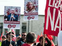 People attend a rally as part of the National Mobilization Day themed 'Let's stop the wars, the time for peace is now' in Rome, Italy, on Oc...