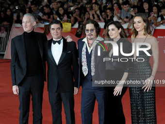 From left: Actor Bruno Gouery, Riccardo Scamarcio, director Johnny Depp, Luisa Ranieri, and Antonia Desplat attend the red carpet of the mov...