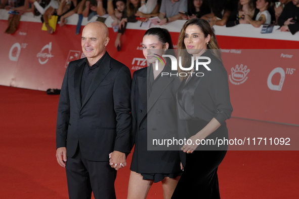 Luca Zingaretti, Emma Zingaretti, and Luisa Ranieri attend the ''Modi - Three Days On The Wing Of Madness'' red carpet during the 19th Rome...