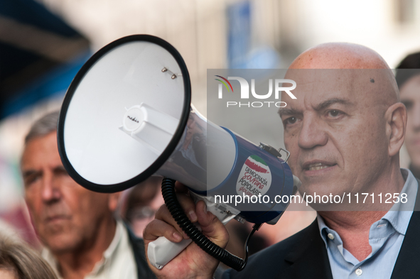 People participate in the demonstration "Italy repudiates war," which is the slogan of the procession that takes place in the streets of Rom...