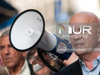 People participate in the demonstration "Italy repudiates war," which is the slogan of the procession that takes place in the streets of Rom...