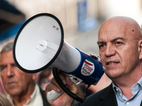 People participate in the demonstration "Italy repudiates war," which is the slogan of the procession that takes place in the streets of Rom...