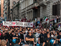 People participate in the demonstration "Italy repudiates war," which is the slogan of the procession that takes place in the streets of Rom...