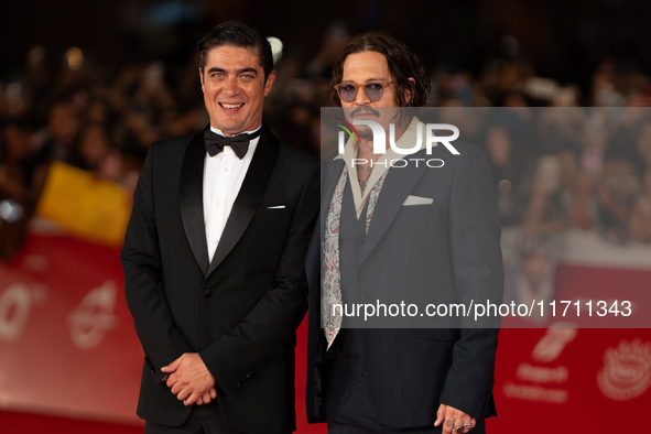 Riccardo Scamarcio and Johnny Depp attend the ''Modi - Three Days On The Wing Of Madness'' red carpet during the 19th Rome Film Festival at...