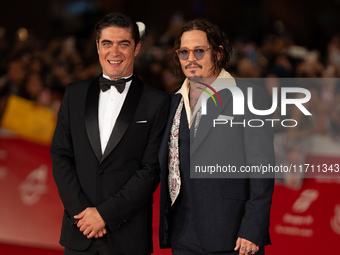 Riccardo Scamarcio and Johnny Depp attend the ''Modi - Three Days On The Wing Of Madness'' red carpet during the 19th Rome Film Festival at...