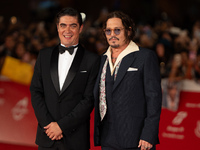 Riccardo Scamarcio and Johnny Depp attend the ''Modi - Three Days On The Wing Of Madness'' red carpet during the 19th Rome Film Festival at...