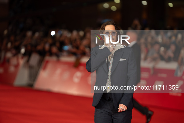 Johnny Depp attends the ''Modi - Three Days On The Wing Of Madness'' red carpet during the 19th Rome Film Festival at Auditorium Parco Della...