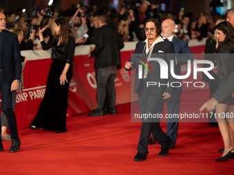 Johnny Depp attends the ''Modi - Three Days On The Wing Of Madness'' red carpet during the 19th Rome Film Festival at Auditorium Parco Della...