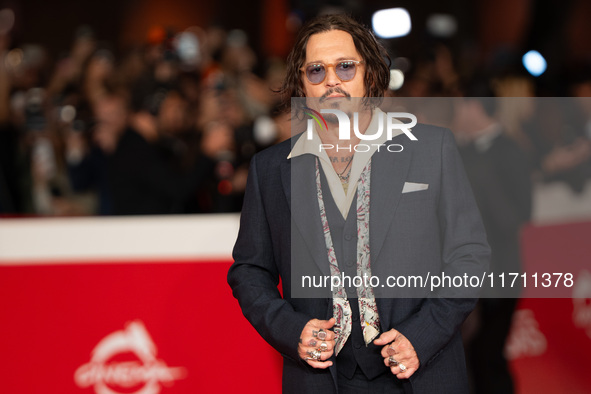 Johnny Depp attends the ''Modi - Three Days On The Wing Of Madness'' red carpet during the 19th Rome Film Festival at Auditorium Parco Della...