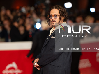 Johnny Depp attends the ''Modi - Three Days On The Wing Of Madness'' red carpet during the 19th Rome Film Festival at Auditorium Parco Della...