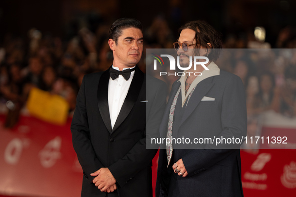 Riccardo Scamarcio and Johnny Depp attend the ''Modi - Three Days On The Wing Of Madness'' red carpet during the 19th Rome Film Festival at...