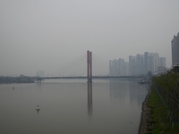 A photo taken on October 26, 2024, shows the bank of the Songhua River under smog in Jilin City, Jilin Province, China. (