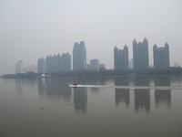 A photo taken on October 26, 2024, shows the bank of the Songhua River under smog in Jilin City, Jilin Province, China. (