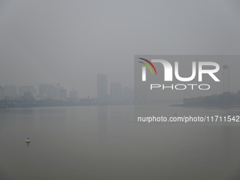 A photo taken on October 26, 2024, shows the bank of the Songhua River under smog in Jilin City, Jilin Province, China. (