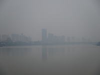 A photo taken on October 26, 2024, shows the bank of the Songhua River under smog in Jilin City, Jilin Province, China. (