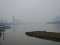 A photo taken on October 26, 2024, shows the bank of the Songhua River under smog in Jilin City, Jilin Province, China. (