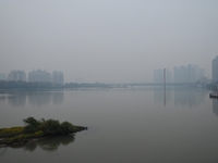 A photo taken on October 26, 2024, shows the bank of the Songhua River under smog in Jilin City, Jilin Province, China. (