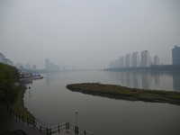 A photo taken on October 26, 2024, shows the bank of the Songhua River under smog in Jilin City, Jilin Province, China. (