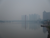 A photo taken on October 26, 2024, shows the bank of the Songhua River under smog in Jilin City, Jilin Province, China. (