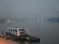 A photo taken on October 26, 2024, shows the bank of the Songhua River under smog in Jilin City, Jilin Province, China. (