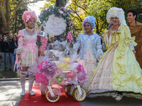 Tiny NYC Cuties, dressed in Baroque style with big gowns, big hair, and corsets, win first prize in the Washington Square Park Halloween Dog...