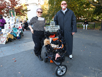 Teresa and Danny from New York City and their dogs, Willow and Sadie, dress as characters from the ''Adams Family'' for the Washington Squar...