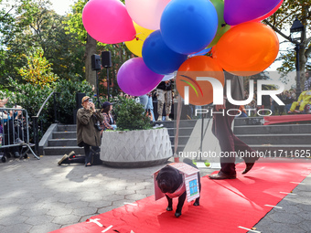 A dog dresses as a character from the movie ''Up'' during the Washington Square Park Halloween Dog Parade in New York, N.Y., on October 26,...