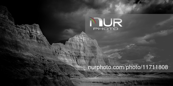 Badlands National Park protects 242,756 acres (379.3 sq mi; 982.4 km2) of sharply eroded buttes and pinnacles, along with the largest undist...