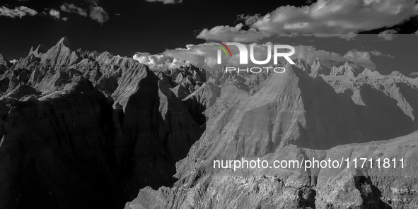 Badlands National Park protects 242,756 acres (379.3 sq mi; 982.4 km2) of sharply eroded buttes and pinnacles, along with the largest undist...