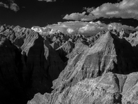 Badlands National Park protects 242,756 acres (379.3 sq mi; 982.4 km2) of sharply eroded buttes and pinnacles, along with the largest undist...